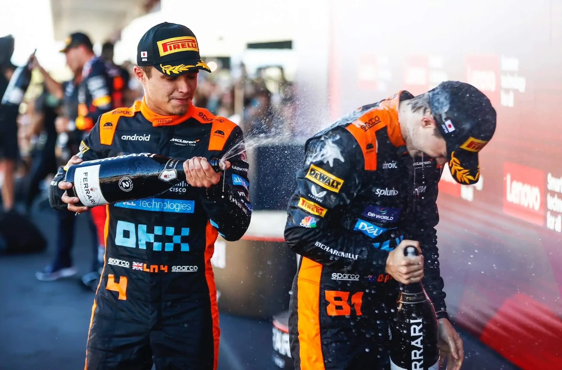 Lando Norris and Oscar Piastri celebrating the McLaren F1 Team's impressive podium streak at the Japanese Grand Prix